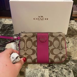 Coach dark pink and tan signature wristlet